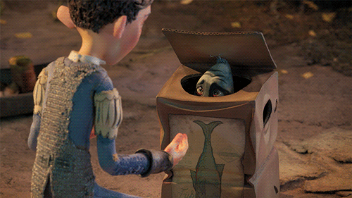 An animated gif of a box troll, shivering. The troll quickly recedes into his box as a man approaches.